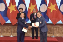Ký các biên bản ghi nhớ về nhập khẩu điện từ Lào về Việt Nam